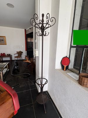 a room with a table and a chair and a window