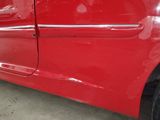 a red car that is parked in a garage