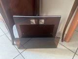 a glass shelf with a mirror on it in a room