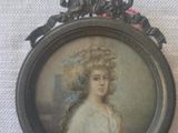 a picture of a woman in a white dress in a picture frame