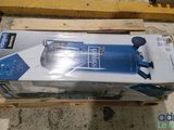 an image of a blue and white water filterer sitting on top of a wooden pallet