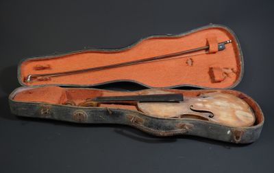 a violin case with a violin in it on a black surface
