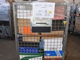 a metal cart with many boxes on it in a warehouse