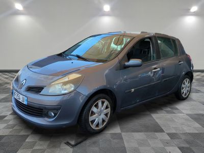 a blue car is parked in a room with a checkered floor