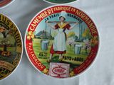 three tins of canned food are sitting on a table