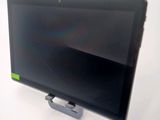 a tablet computer sitting on top of a stand