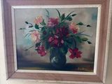 a painting of flowers in a vase on the wall