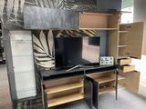 a tv that is sitting on a stand in a room
