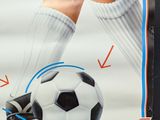 a poster of a soccer player holding a soccer ball