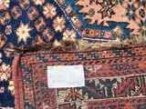 an image of a close up of a rug with a tag on it