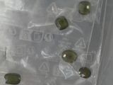 a lot of olives in a plastic bag on the table