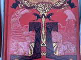 an old book with a picture of a tree on top of it