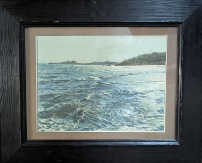framed picture of a picture of a body of water with a boat in the distance