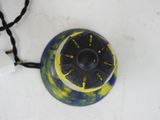 a black and yellow object on a white surface