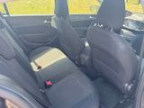 two seats in the back of a car with a seat belt