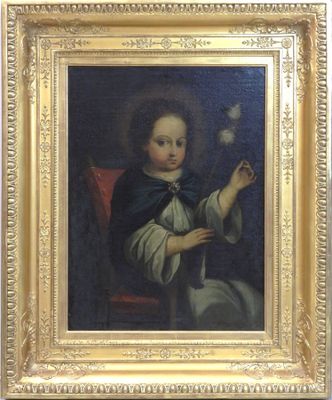 tableau représentant un jeune garçon tenant une fleur, dans un cadre doré