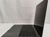 an open laptop computer sitting on top of a white table
