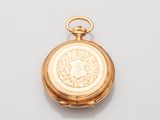 an image of a gold pocket watch on a white surface