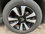 a close up view of a tire on a car