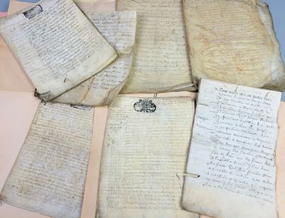 some old papers are sitting on top of a table