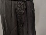a woman ' s black skirt with lace on the side