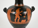 a black vase with a red and black design on it