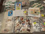 a table with a lot of stamps and postcards on it