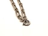 a silver chain with a heart charm on it