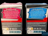 two boxes of cigarettes sitting on a black surface