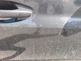 a close up of a car door handle with a sticker on it