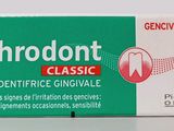 an image of a box of toothpaste sitting on top of a table