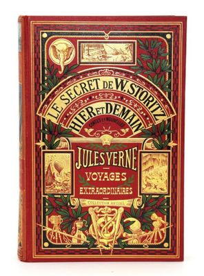 un livre rouge orné de lettres dorées et d'illustrations