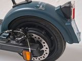 a toy motorcycle that is sitting on a white surface