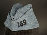 a hat with a number on it sitting on a mannequin head