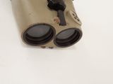 a pair of binoculars sitting on top of a white table