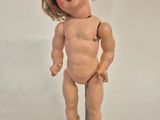 a small doll that is standing on a table