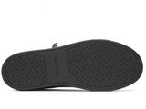 a close up view of the sole of a black shoe