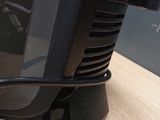 a black computer on a wooden table with a mouse