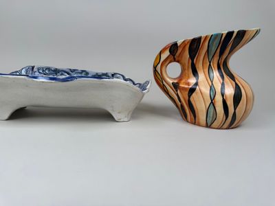 two vases sitting next to each other on a table