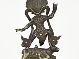 bronze statue of a person with a bird on his head