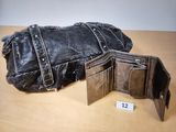 a black purse and a wallet sitting on a table