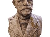 statue of a bust of a man wearing a suit and tie