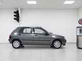 a picture of a car in a garage with a gas pump