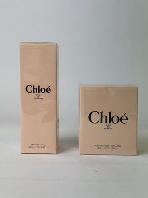 two boxes of chloe perfume sitting on a white surface