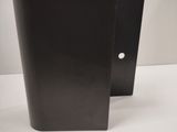 two black metal vases sitting on top of a white table