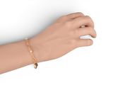 bracelet with a gold chain on a mannequin hand on a white background