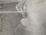 a close up picture of a person wearing a wedding dress