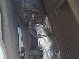 a bag of luggage in the back of a car