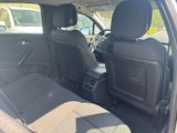 the back seats of a car are empty in a parking lot
