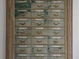a large wooden cabinet with a lot of drawers on it